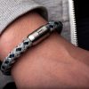 Close up donned nautical bracelet Mackerel silver gray navy blue from Fischers Fritze, with stainless steel engraving