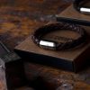 Bracelet leather brown braided and gift box lie on workbench in the Fischers Fritze workshop